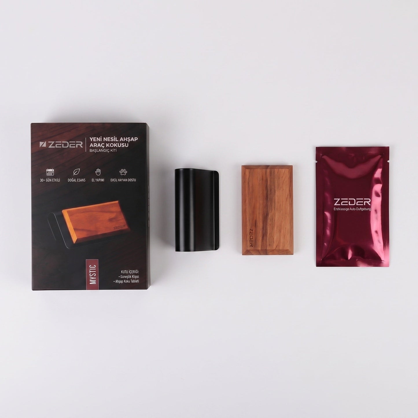 Kutu içeriği — metal klips, ahşap tablet ve MYSTIC koku poşeti
