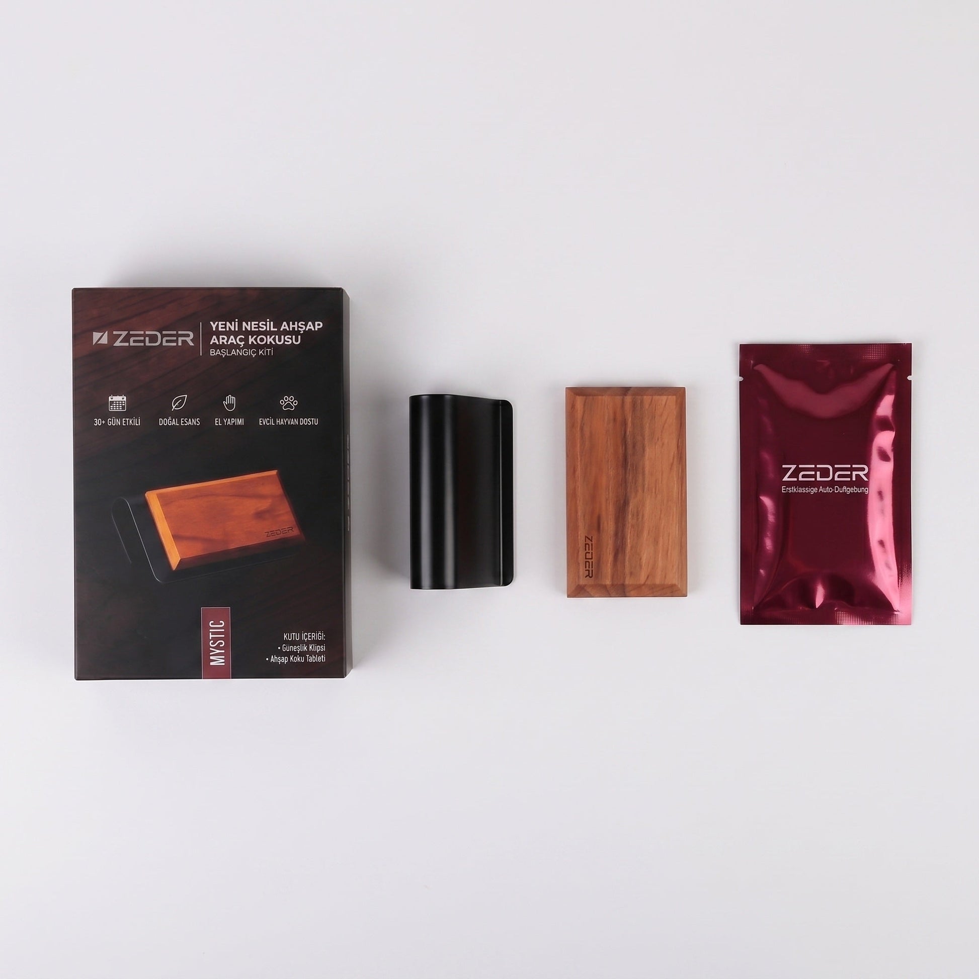 Kutu içeriği — metal klips, ahşap tablet ve MYSTIC koku poşeti