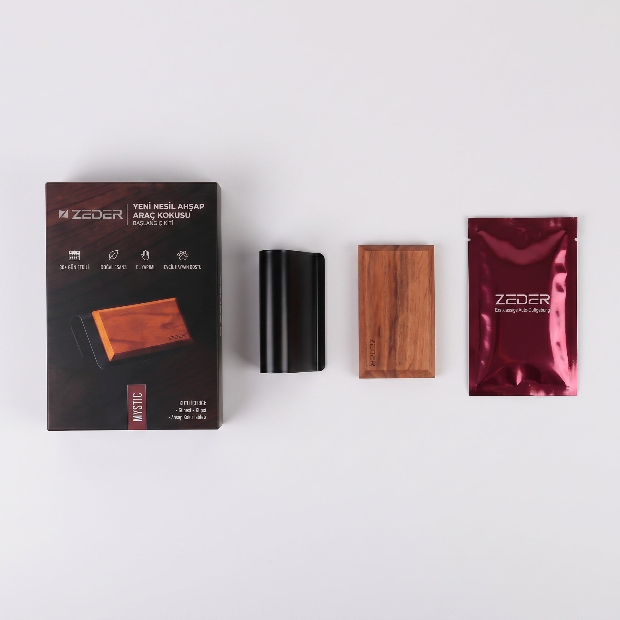 Kutu içeriği — metal klips, ahşap tablet ve MYSTIC koku poşeti